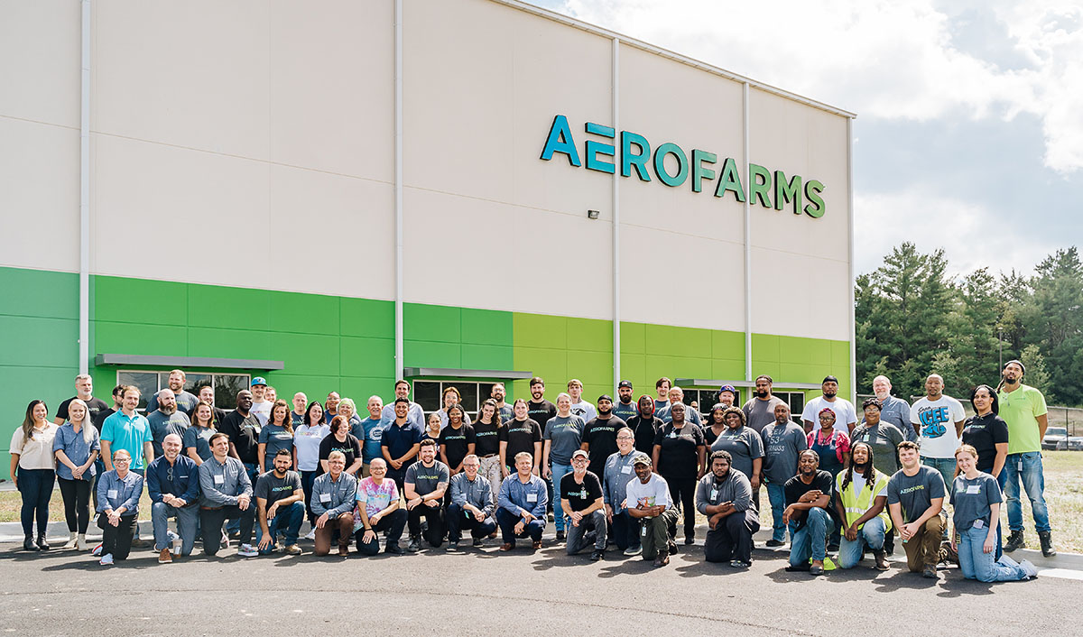 AeroFarms team members stand in front of AeroFarms Danville
